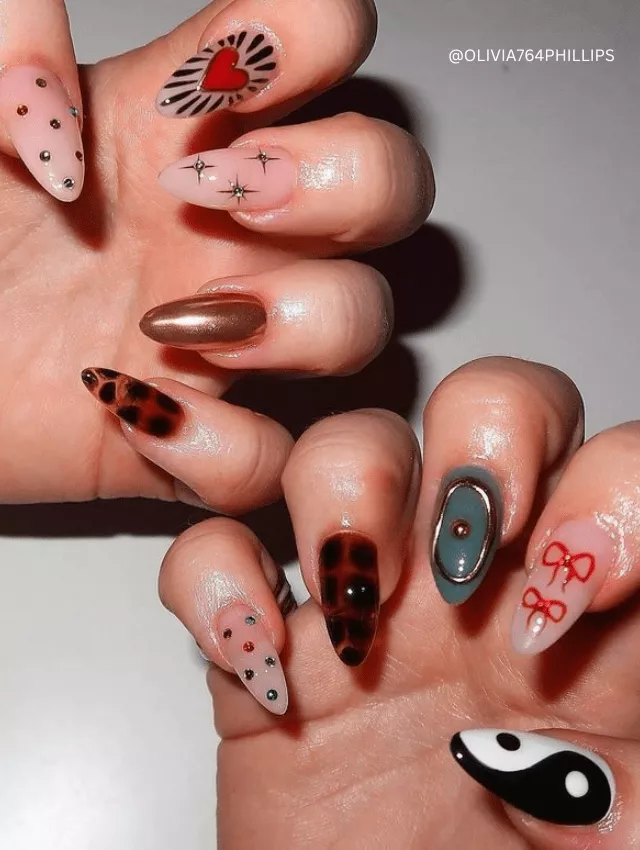 Tortoiseshell, metallic, and abstract nail designs combined in a bold, mismatched style.