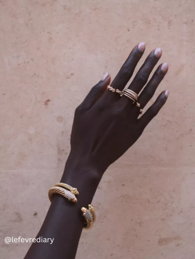 Close-up photo of a hand displaying classic nude soap nails with a shiny finish.