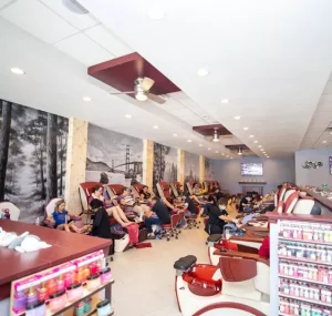 Inside view of Jay Anthony Nail Spa showing clients receiving pedicure treatments in massage chairs.