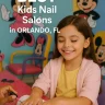 A girl getting her nails done at a kids nail salon with Mickey and Minnie Mouse on the wall in Orlando