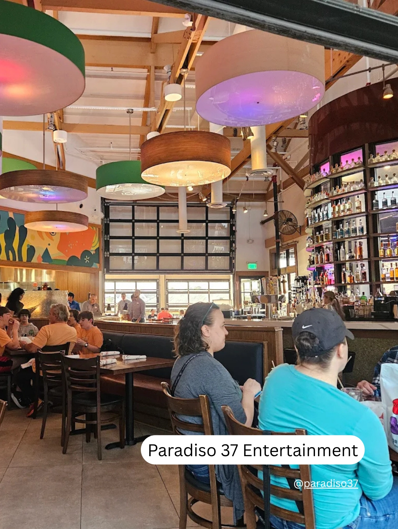 Guests dining and drinking at Paradiso 37, enjoying the essence of Party Near Disney Orlando.