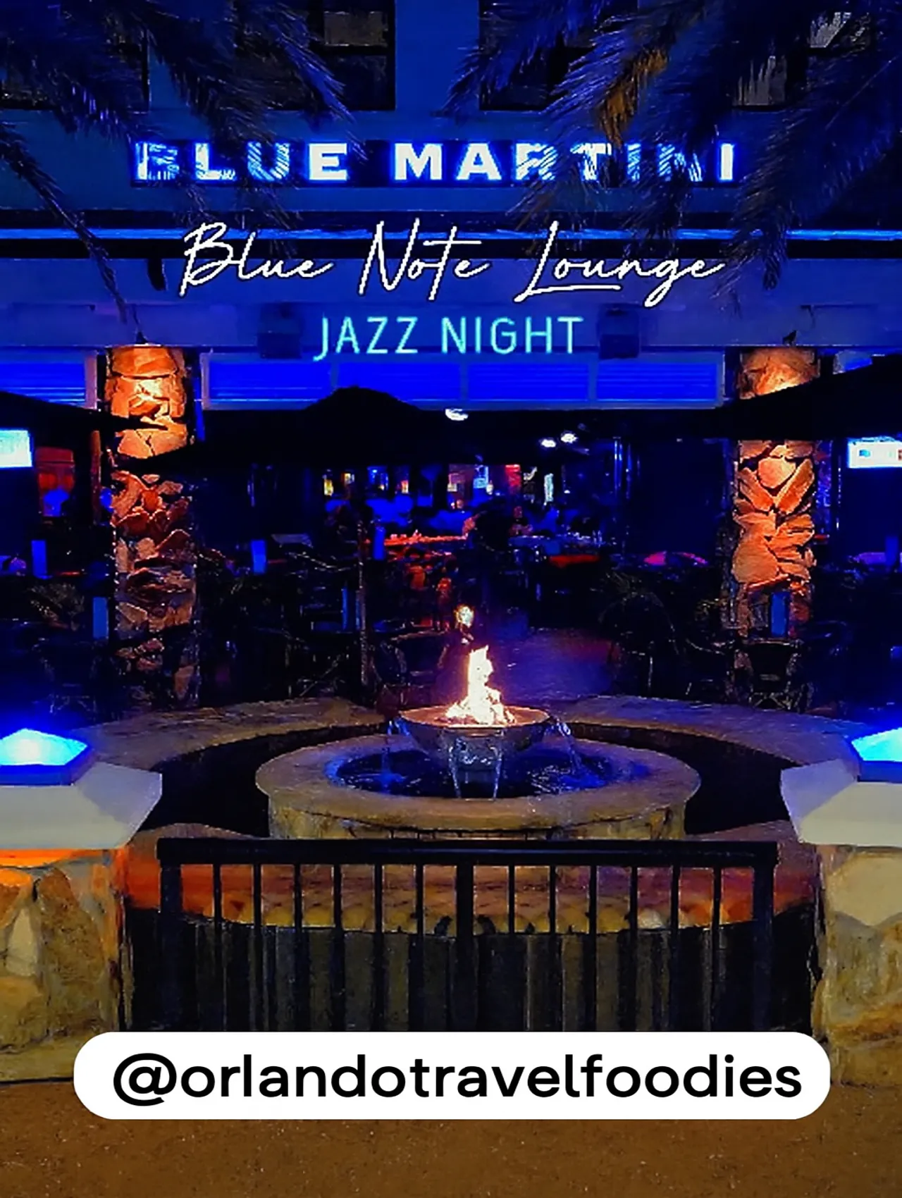 A lively nighttime scene with glowing lights, outdoor seating, and a cozy fire pit, perfect for partygoers near Disney Orlando.