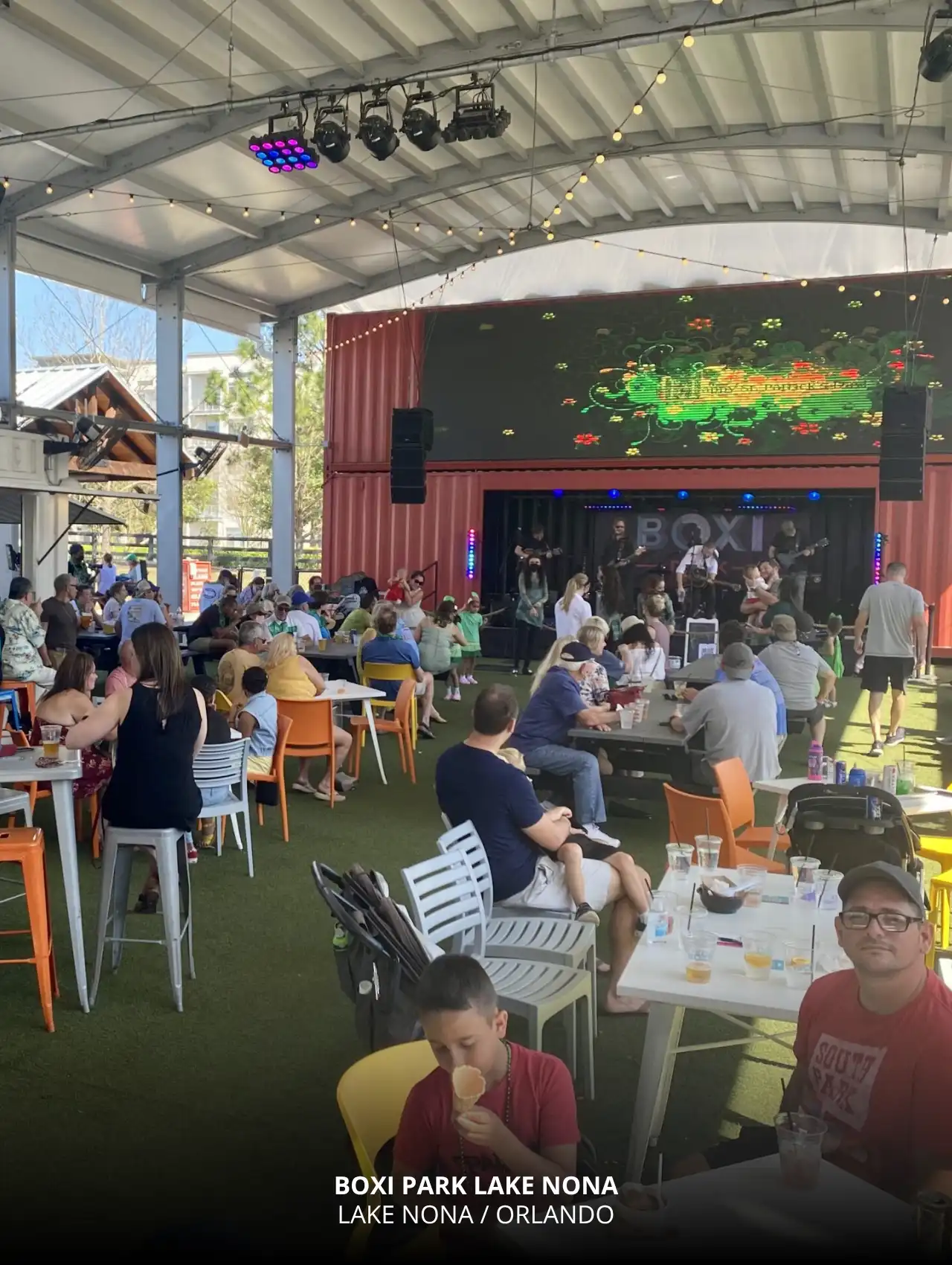Boxi Park Lake Nona with families enjoying live music and drinks at one of the top sports bars in Orlando.