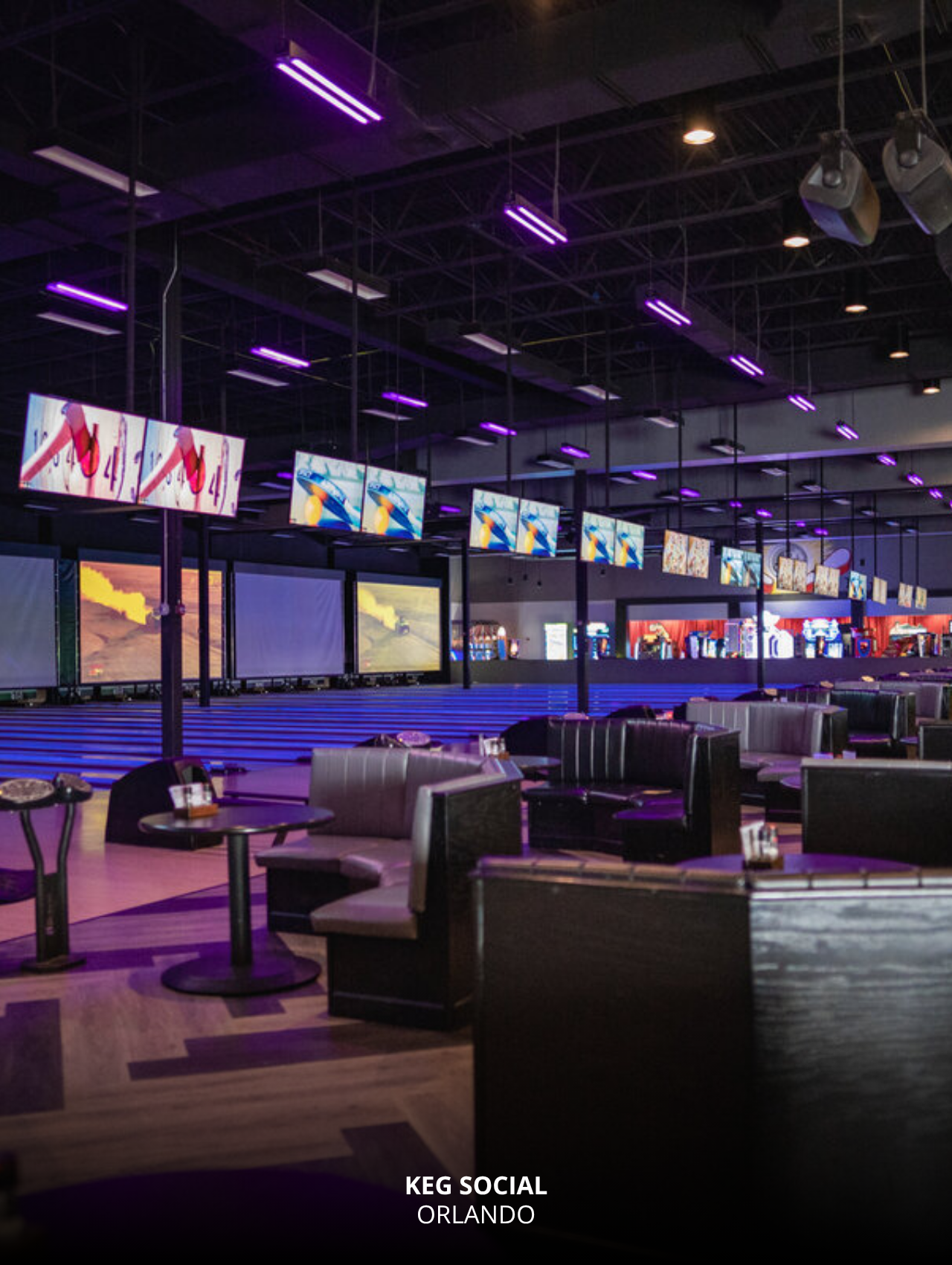 Neon-lit bowling alley and screens at Keg Social, Orlando Sports Bars