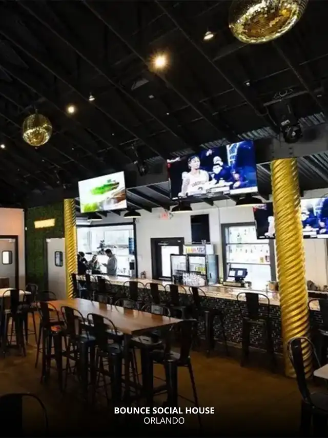 Interior of Bounce Social House in Orlando featuring TVs, bar seating, and a stylish setup – Orlando UCF Bars