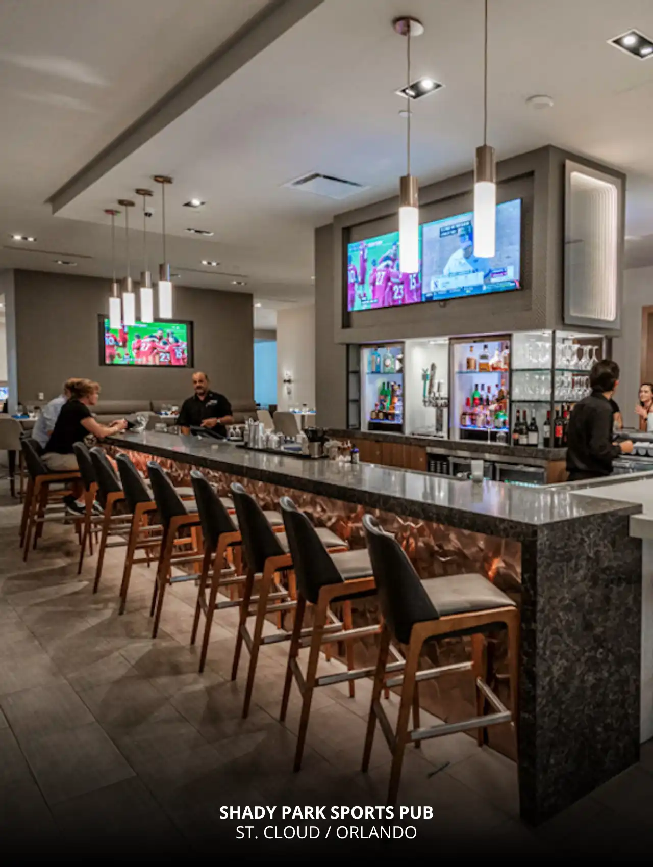 Sleek modern interior of Shady Park Sports Pub with large TVs and full bar, one of the most stylish sports bars in Orlando.