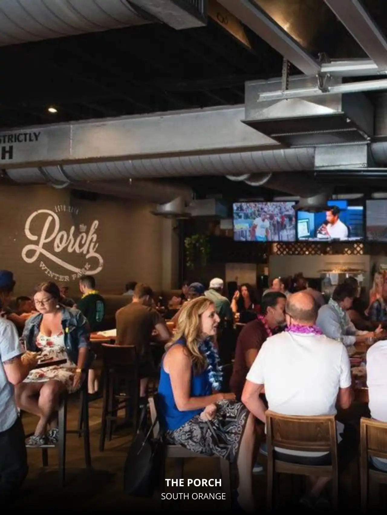 Lively crowd enjoying sports at The Porch in Winter Park, Orlando Sports Bars