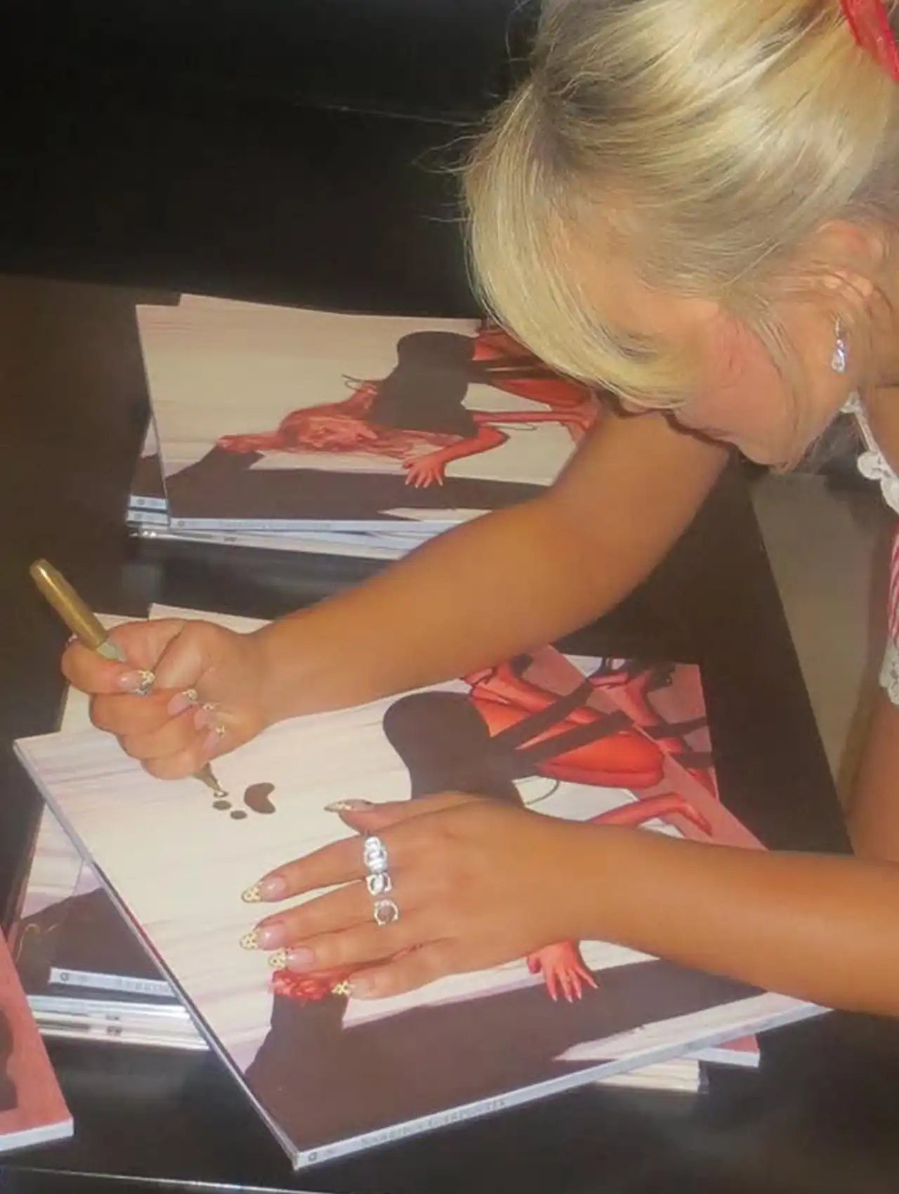 Sabrina Carpenter Polka Dot French Tips Nails while signing albums at a release event