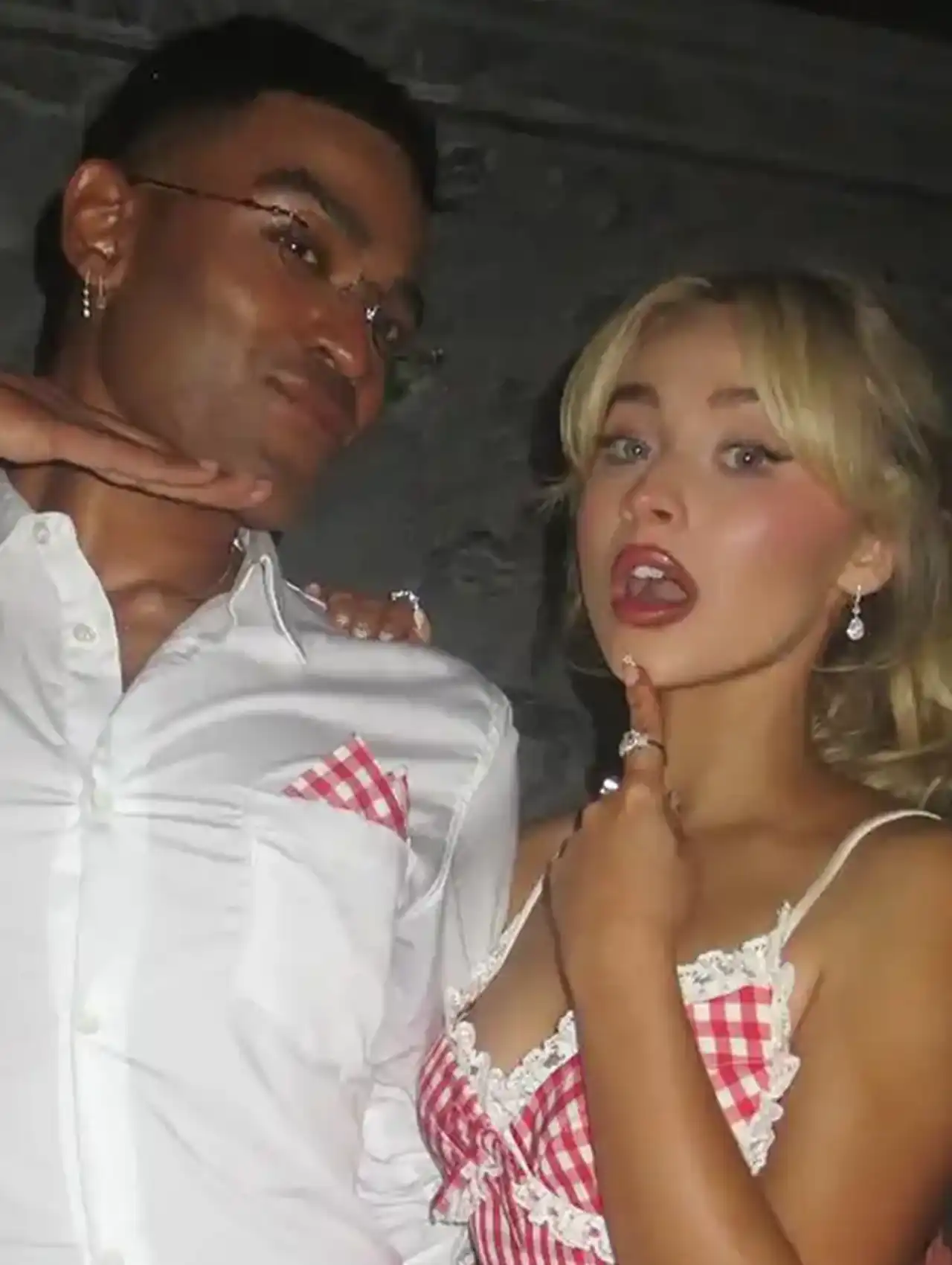 Sabrina Carpenter Polka Dot French Tips Nails styled with red checkered dress at a night out