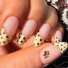 Close-up of Sabrina Carpenter Polka Dot French Tips Nails with yellow and brown dots