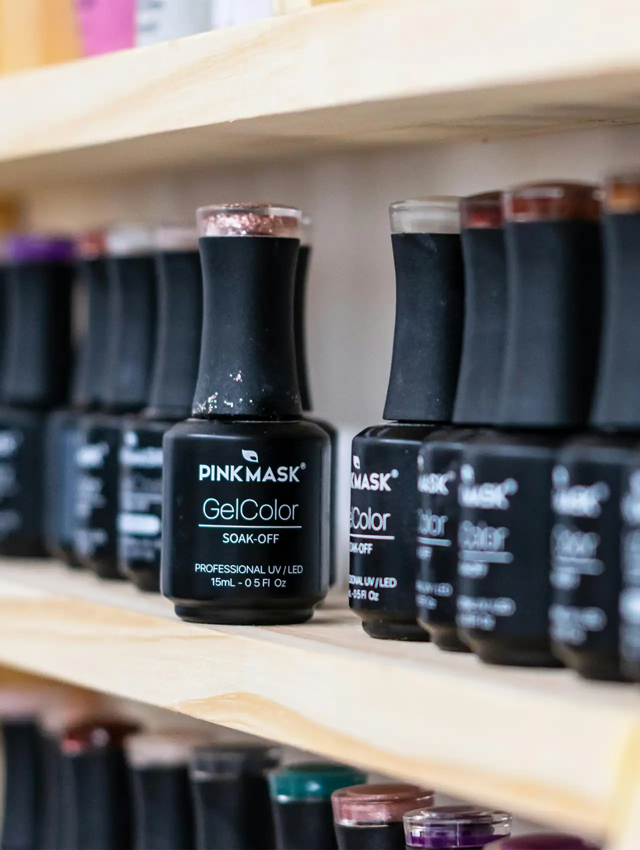 Collection of Pink Mask GelColor bottles including topcoat nail polish