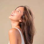 True Self-Care Starts Inside image featuring a woman smiling and looking upward, symbolizing confidence and Gut Balance wellness.