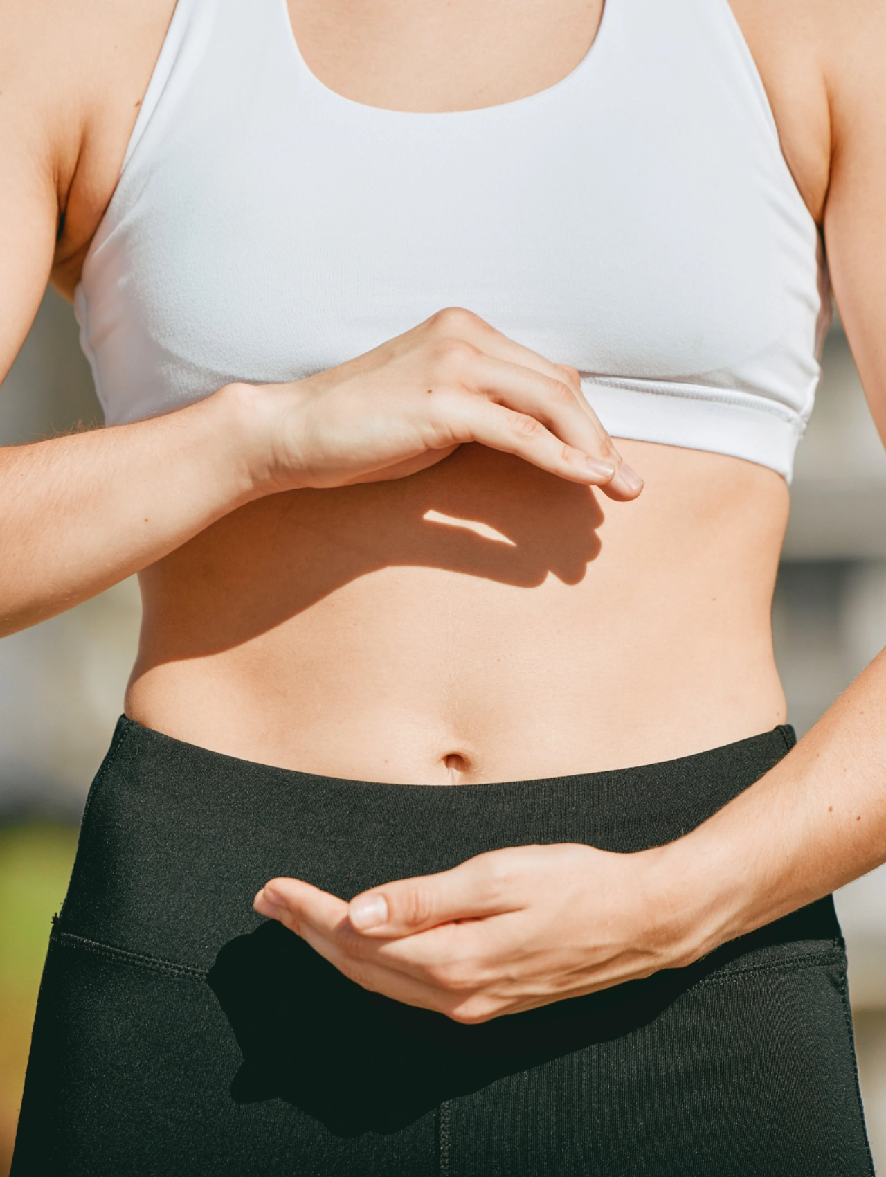 What Does Your Gut Do image showing a woman touching her stomach area, illustrating Gut Balance and digestive health.